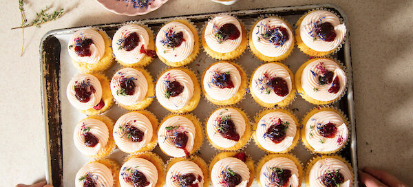 Baking sheet full of cupcakes
