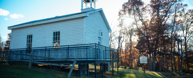 Longs Chapel at Zenda with sun and trees in the background
