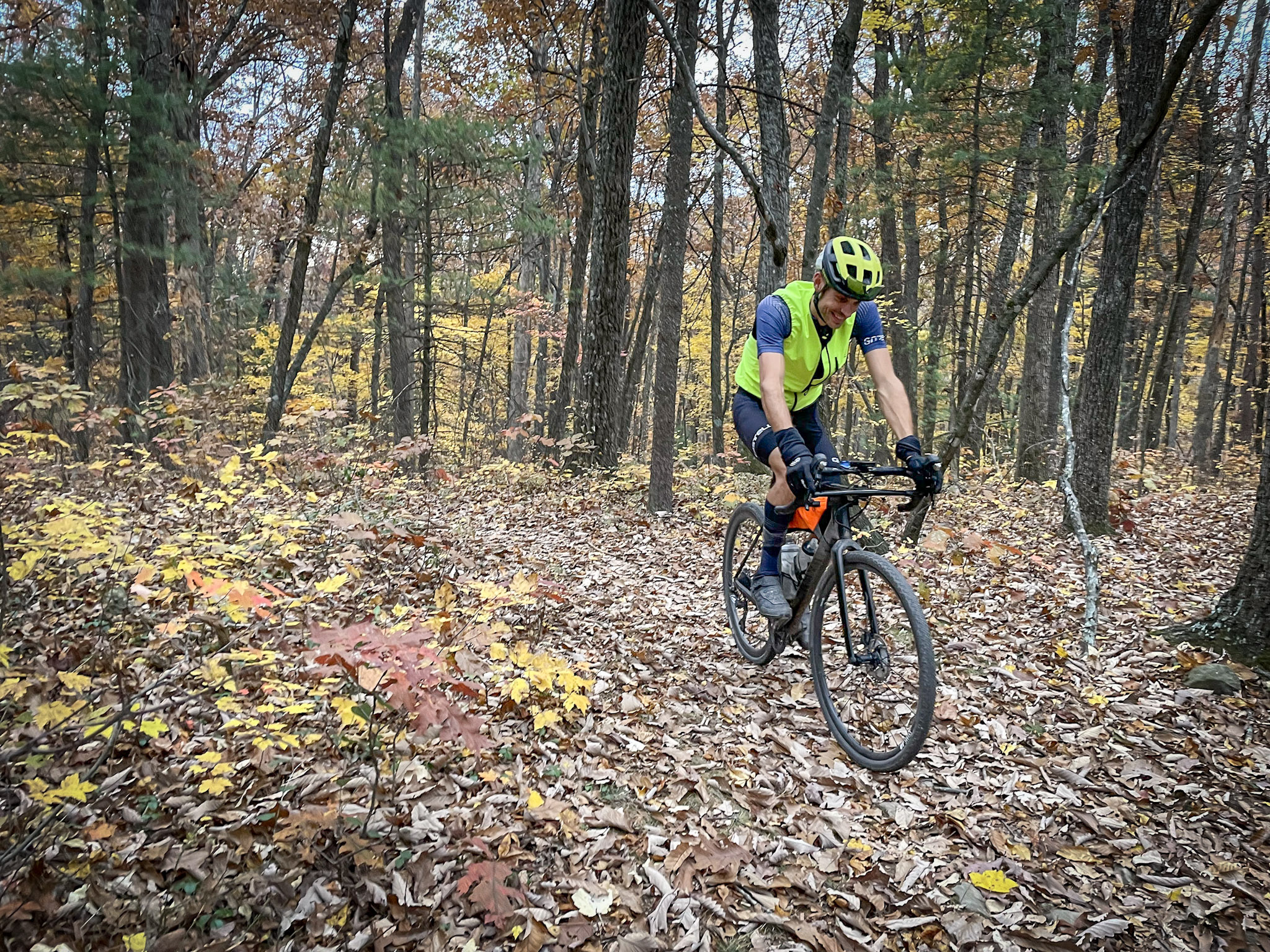 person riding bike in woods