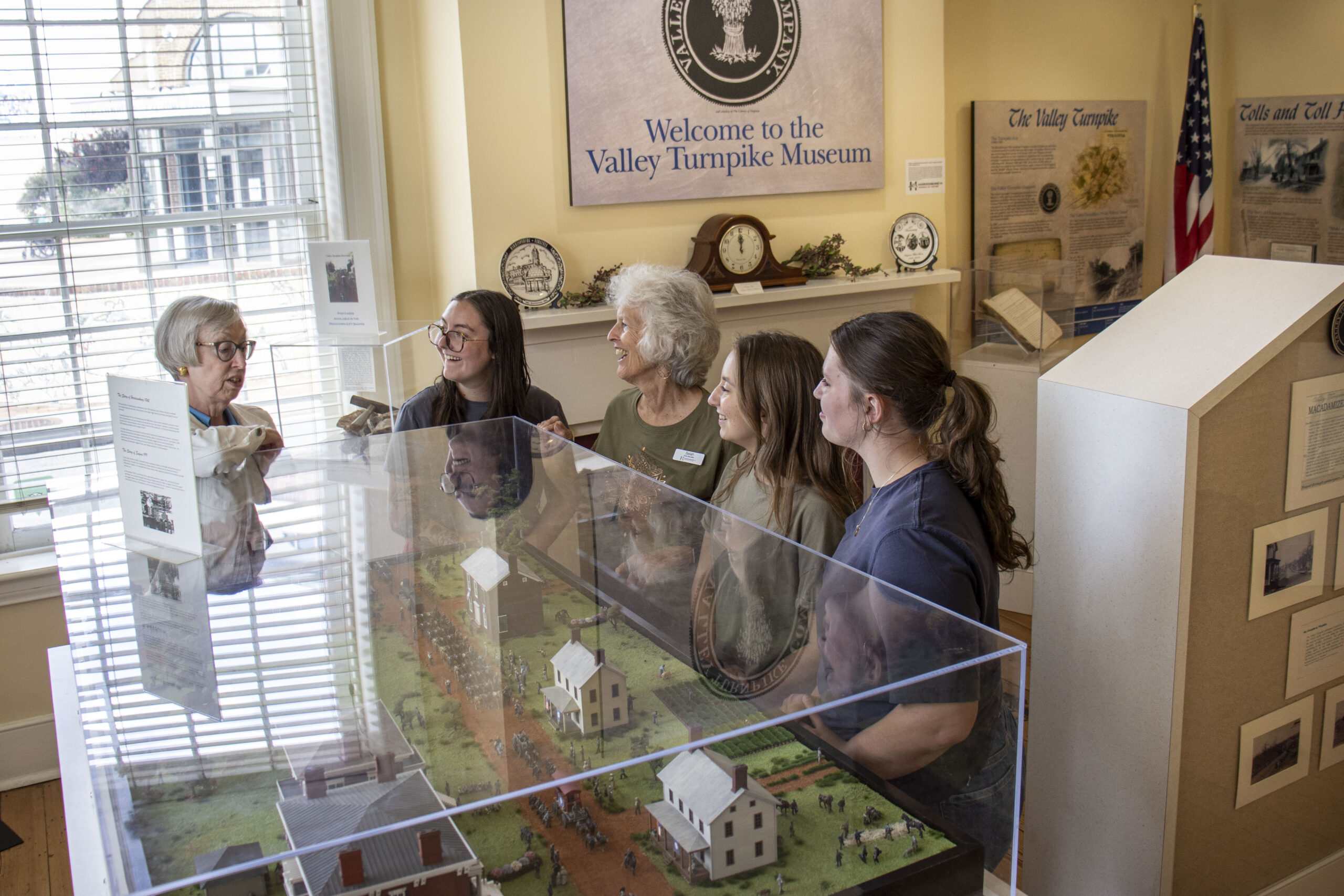 Ladies standing in the Valley Turnpike museum on a tour