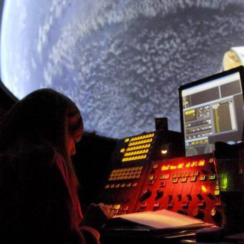 Planetarium person working the controls