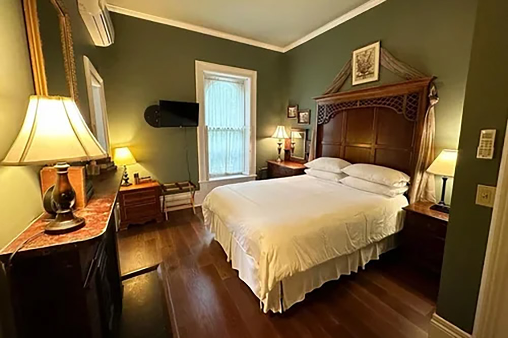 Hotel Room at Table 1888 with green walls