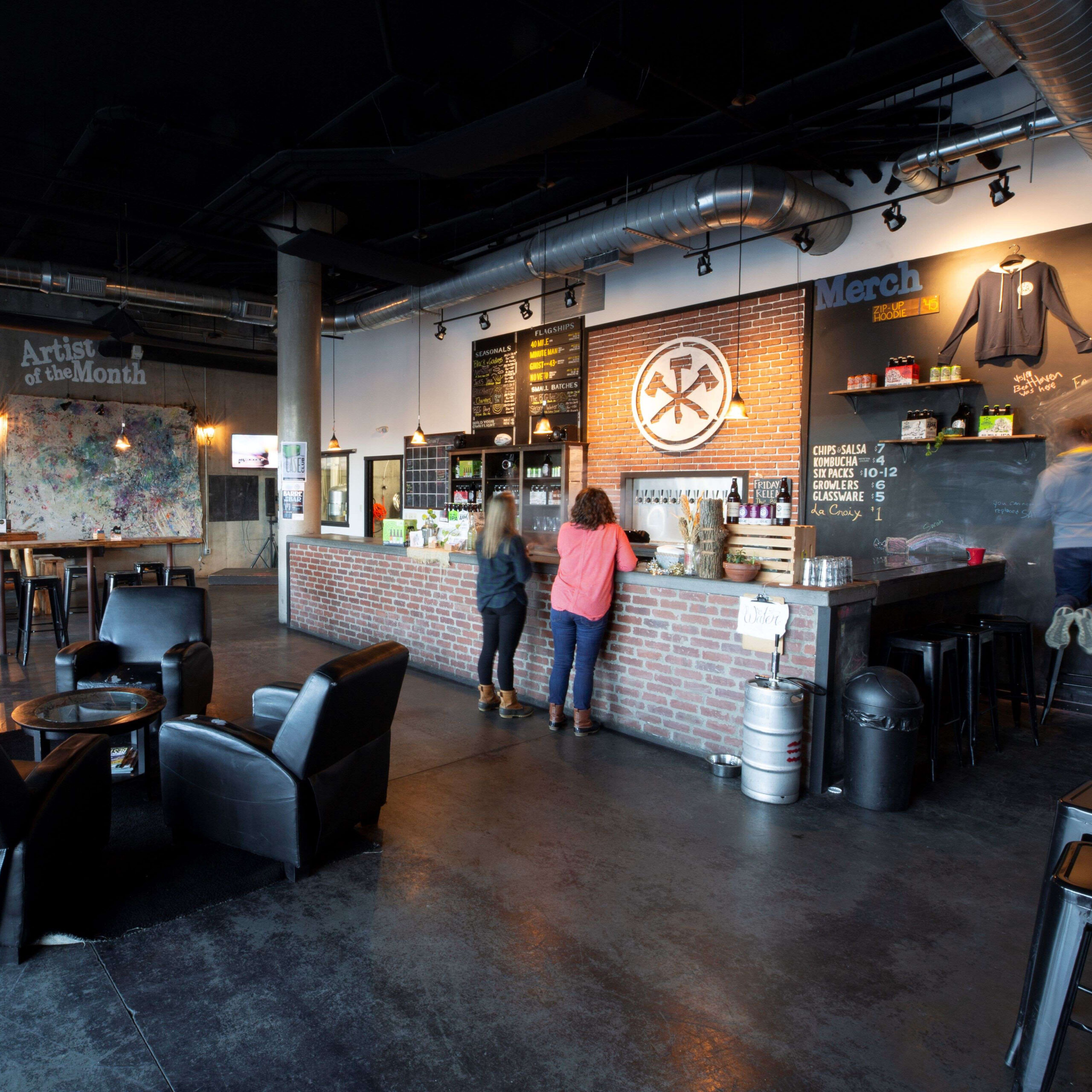 People standing at bar area at Three Notched Brewery