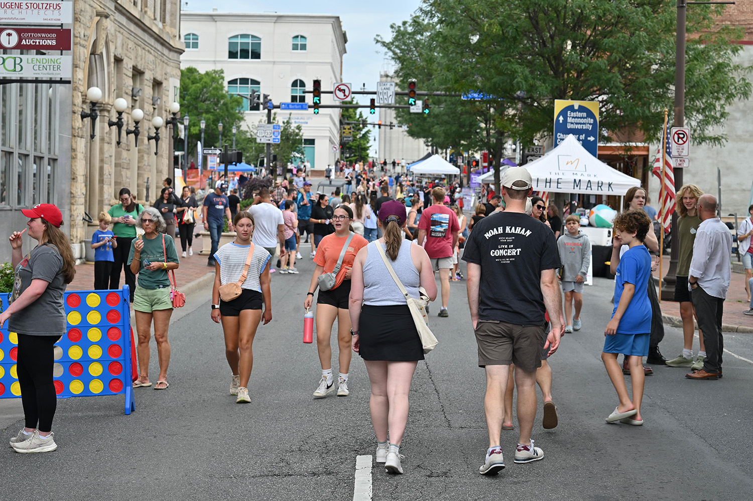People walking the street during a festival in downtown Harrisonburg