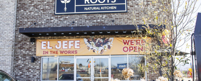 Outside of Roots Natural Kitchen on a sunny day