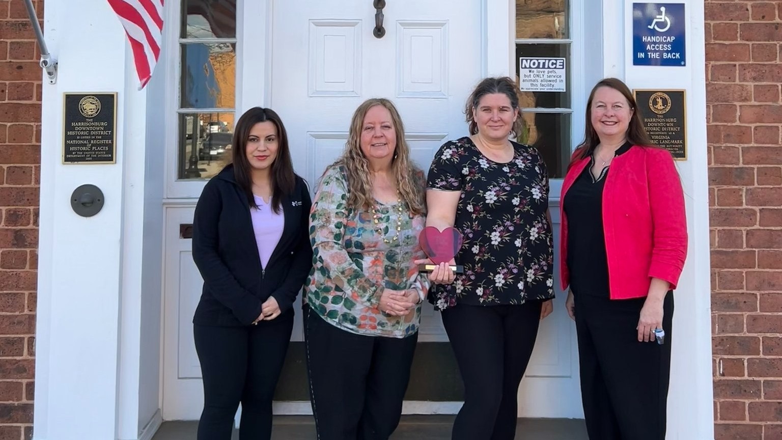 Staff members of Hardesty Higgins House holding the Trailblazer award.