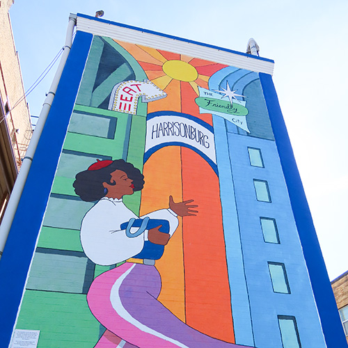 Vibrant Mural on side of building in Harrisonburg embodying the Friendly City
