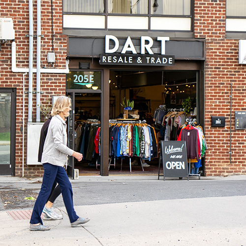 People walking in front of Dart Resale and Trade storefront