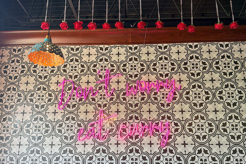 Don't worry, eat curry on a neon sign