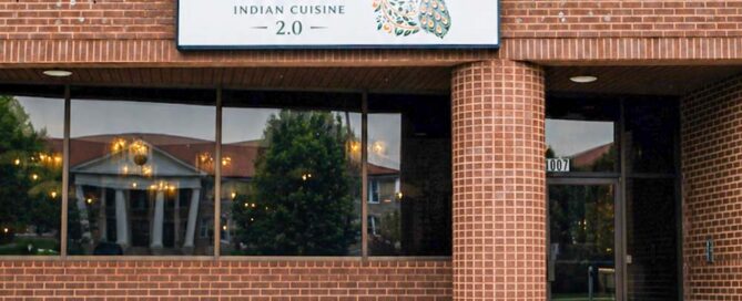 Taaza Indian Cuisine sign on brick building